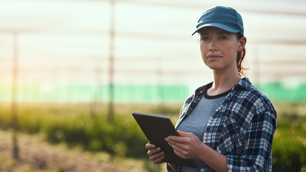 Woman using internet in a farm