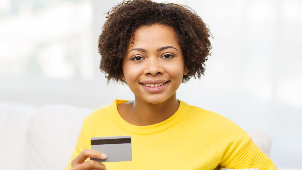 Happy woman with credit card
