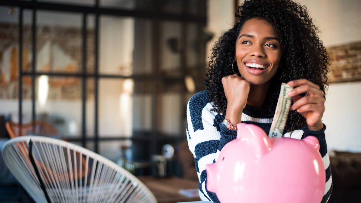 Happy woman saving money